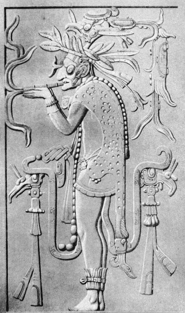 A reproduction of a carving from the temple at Palenque, Mexico, depicting a Maya deity using a smoking tube