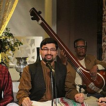 Photo of Mohammad Aizaz Sohail while performing at PTV Home's program 'Firdous-e-Gosh'