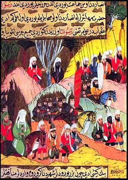 Mohammed (in green, lower left) marching to the Battle of Uhud. From the Siyer-i Nebi.jpg