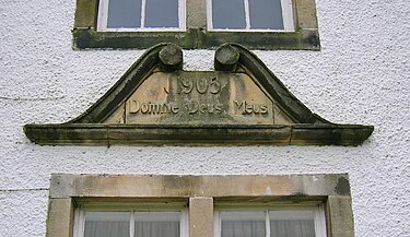 Stone recording the 1905 extension. The Latin translates as 'The Lord my God'. Monkredding - inscription.JPG