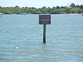 Sign marking location, and warning against vandalism