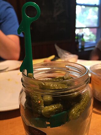 Green plastic pickle lifter in a jar of Maille cornichons Pickle-lifter-maille.jpg