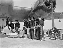 Ground crew loading ammunition for the cannon of an RAF Beaufighter Mk.VI night fighter Royal Air Force Fighter Command, 1939-1945. CE21.jpg