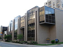 A street level view of the School of Dental Medicine's Salk Hall Annex. The Pennsylvania historical plaque honoring Jonas Salk's research conducted in Salk Hall that resulted in the first polio vaccine can be seen at the bottom right. Salk Hall Annex.JPG