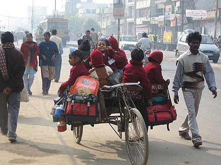 Children in a school-rickshaw on their way to school