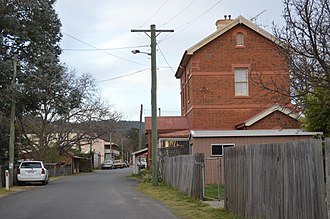 The same street depicted in the painting, as seen in 2015 Sofala Denison Street 001.JPG