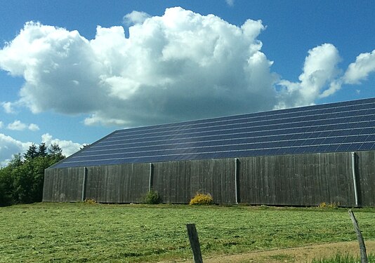 Solar panels on a wooden building in Haute-Vienne, France