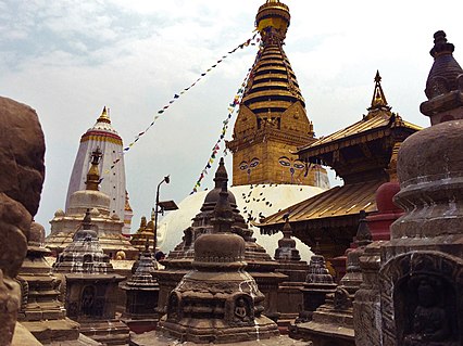 Swayambhunath stupa along with smaller stupas and pagodas in the foreground