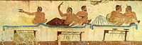 Een fresco met een drinkgelag uit 475 v.C. Paestum Museum, Italië