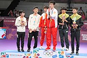 Deutsch: Tischtennis bei den Olympischen Jugendspielen 2018; Tag 9, 15. Oktober 2018; Mixed Medaillenzeremonie - Gold: Yingsha Sun & Wang Chuqin (CHN), Silber: Miu Hirano & Tomokazu Harimoto (JPN), Bronze: Su Pei-ling & Lin Yun-ju (TPE)); Medaillen-Verleiher: IOC member Ryu Seung-minu (KOR), Maskottchen-Verleiher: ITTF Vice-Presiden Nestor Tenca (ARG) English: Table tennis at the 2018 Summer Youth Olympics at 15 October 2018 – Mixed Medal Ceremony - Gold: Yingsha Sun & Wang Chuqin (CHN), Silver: Miu Hirano & Tomokazu Harimoto (JPN), Bronze: Su Pei-ling & Lin Yun-ju (TPE)); Medal presenter: IOC member Ryu Seung-minu (KOR), Mascot presenter: ITTF Vice-Presiden Nestor Tenca (ARG)