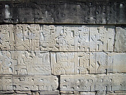Carvings on the wall of the ball-court