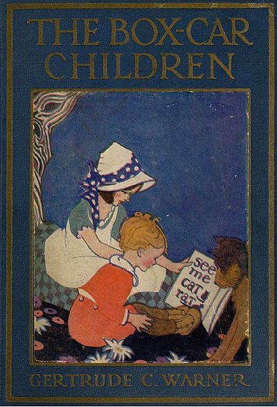 A small group of children huddled around a book with the title of the novella and the author′s name written above and below