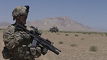 U.S. Army Spc. Mickie Lerma, with 5th Squadron, 7th Cavalry Regiment provides over watch security for his team during the first independent mission for the 2nd Mobile Strike Force, Afghan National Army. U.S. Army Spc. Mickie Lerma, with the 5th Squadron, 7th Cavalry Regiment, 1st Armored Brigade Combat Team, 3rd Infantry Division, Combined Task Force Raider, provides security for his team during the Afghan 130610-A-QA210-280.jpg