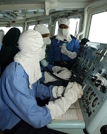 Pakistan Navy's sailors wearing anti-flash gear while operating a Guided missile frigate, PNS Alamgir.