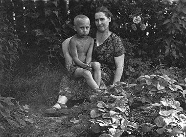 Five-year-old Vladimir Putin with his mother, Maria, in July 1958