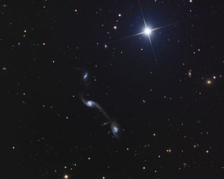 <span class="mw-page-title-main">Wild's Triplet</span> Galaxy group of three small interacting galaxies