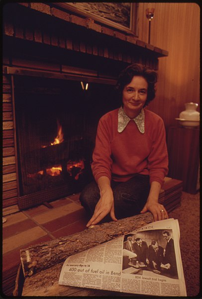 File:Women Uses Her Home Fireplace for Heat. A Newspaper Headline before Her Tells of the Community's Lack of Heating Oil 10-1973 (4271701391).jpg