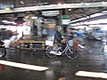 Worker on bicycle at Tsukiji Fish Market.jpg