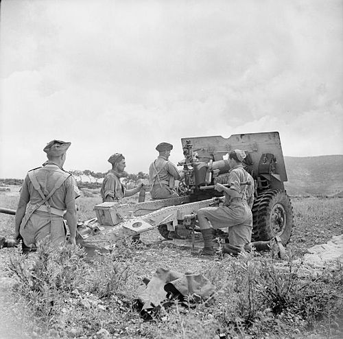 A 25-pdr field gun of 153rd Field Regiment during a practice shoot in June 1943.