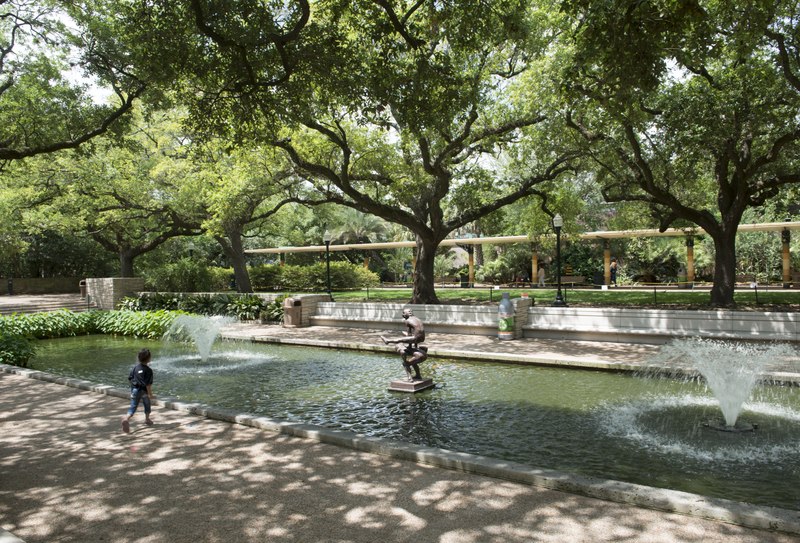 File:A boy enjoys a lovely pond and fountain away from the animals at the Houston, Texas, zoo LCCN2014633251.tif