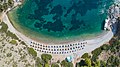 Aerial view of Nikolaos Beach Hydra, Greece (43959303125).jpg