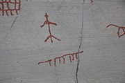 English: Rock art in the world heritage area in Alta, Norway. This is from the area Bergbukten 4b, a group of 195 figures. 22-24 m above sea level, and 6000-7000 years old.