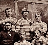 Scotland players, including Andrew Watson (top centre), wearing an atypical light blue-and-white hooped jersey in 1882 Andrew Watson Footballer.jpg