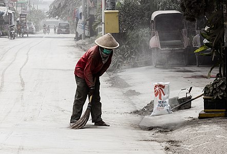 Man sweeping volcanic ash, by Crisco 1492
