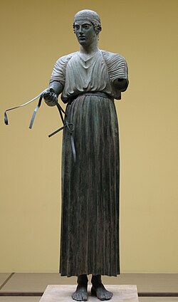 Bronze statuette of an artisan with silver eyes, Greek