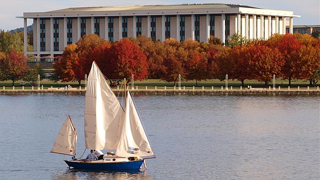 The library seen from Lake Burley Griffin in autumn.