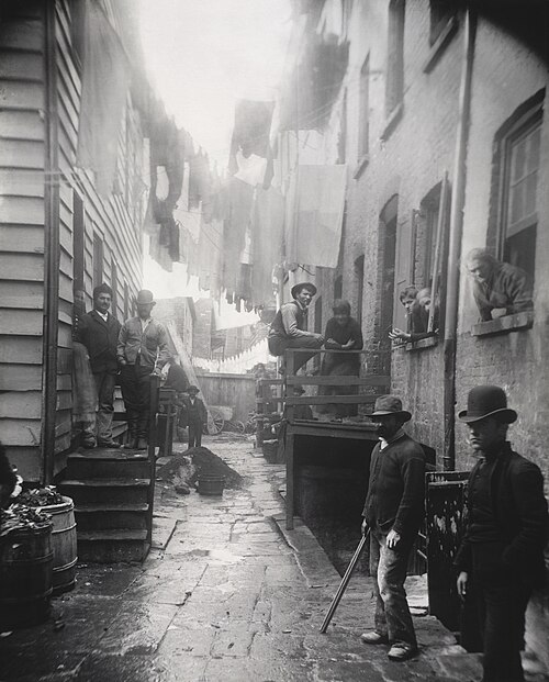 Bandits' Roost, 59 1/2 Mulberry Street (1888) by Jacob Riis, from How the Other Half Lives. This portrays the infamous Mulberry Bend, which was transf