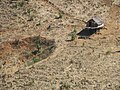 Bomb crater in farming fields, Laos 2009. Photo- AusAID (10677551563).jpg