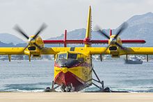 A Spanish Canadair CL-215T exiting the water after a flight at Visita LEPO 2016 CL-215T 43-21 (29733827710).jpg