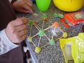 Constructing a pyramid of tatrahedrons from sugared jubes.jpg