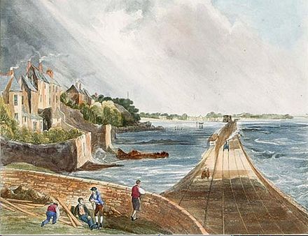 View from Blackrock railway station (1834). The Williamstown Martello tower is depicted in the distance, to the left of the train track, surrounded by water at high tide.
