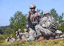 Troops of the 181st Infantry Regiment preparing to fire mortars Defense.gov News Photo 100831-A-3843C-197 - U.S. Army Pfc. Joseph Guzman 1st Battalion 181st Infantry Regiment prepares to drop a 60mm mortar to launch at fixed targets at Camp Atterbury.jpg