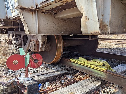 A derailed train car at a closed siding