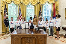 President Trump and First Lady Melania Trump with students in the Oval Office at the announcement of the initiative Donald Trump and Melania Trump at the announcement of the First Lady's Be Best initiative.jpg