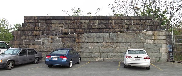 One remaining section of the former railroad embankment near Roxbury Crossing