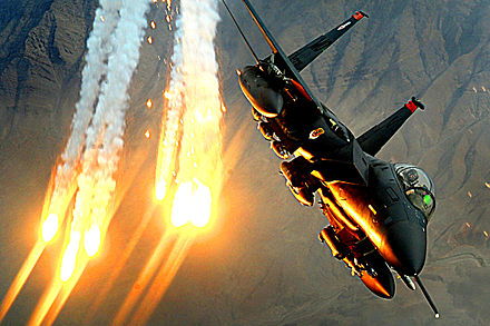 An F-15E of the 391st Expeditionary Fighter Squadron launching heat decoys over Afghanistan, 2008
