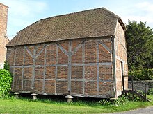 This 17th-century half-timbered granary is used for church activities. Former Granary outside St George's Church, Eastergate (NHLE Code 1233525).JPG