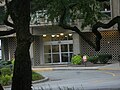 The front entrance to Charlesbank, as seen across the traffic circle from under a tree