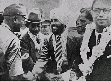 Major Iwaichi Fujiwara greets Mohan Singh, leader of the First Indian National Army. Circa April 1942.