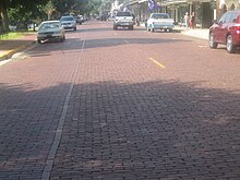 Front Street along the Cane River in historic Natchitoches, Louisiana, is paved with bricks. Historic brick street in Natchitoches, LA IMG 1943.JPG