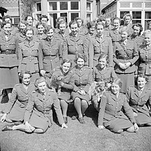 Princess Elizabeth (centre) with officers of the ATS Training Centre Hrh Princess Elizabeth Undergoing Instruction at the Auxiliary Territorial Service Training Centre, April 1945 H41676.jpg