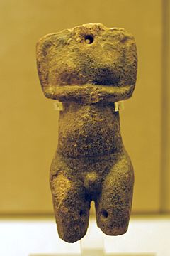 Female torso in darker stone with a hole in the throat and dírkama thighs, Plastiras type (EC I, 2800–2700 BCE; Museum of Prehistoric Thera)