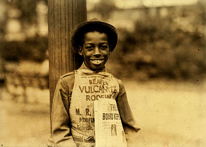 Roland, eleven year old newsboy in: Newark, New Jersey. Photograph by Lewis Wickes Hine, 1 August 1924.