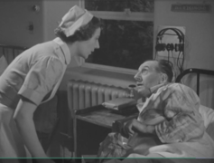 Life in Her Hands (1951), nurse Ann Peters (Kathleen Bryan) with male patient.png