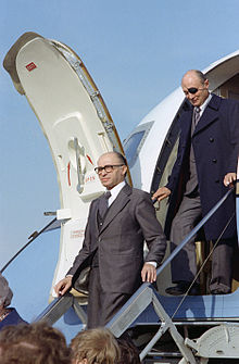 Menachem Begin, Prime Minister of Israel and in charge of the operation, disembarks from an aircraft upon his arrival in the United States, accompanied by Israeli Foreign Minister Moshe Dayan.