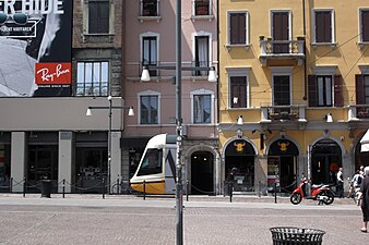 Tram hiding behind a lightpost at Porta Ticinese, Milan